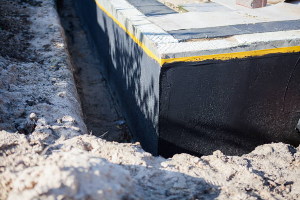 Professional Waterproofing technician working in Alton, NY